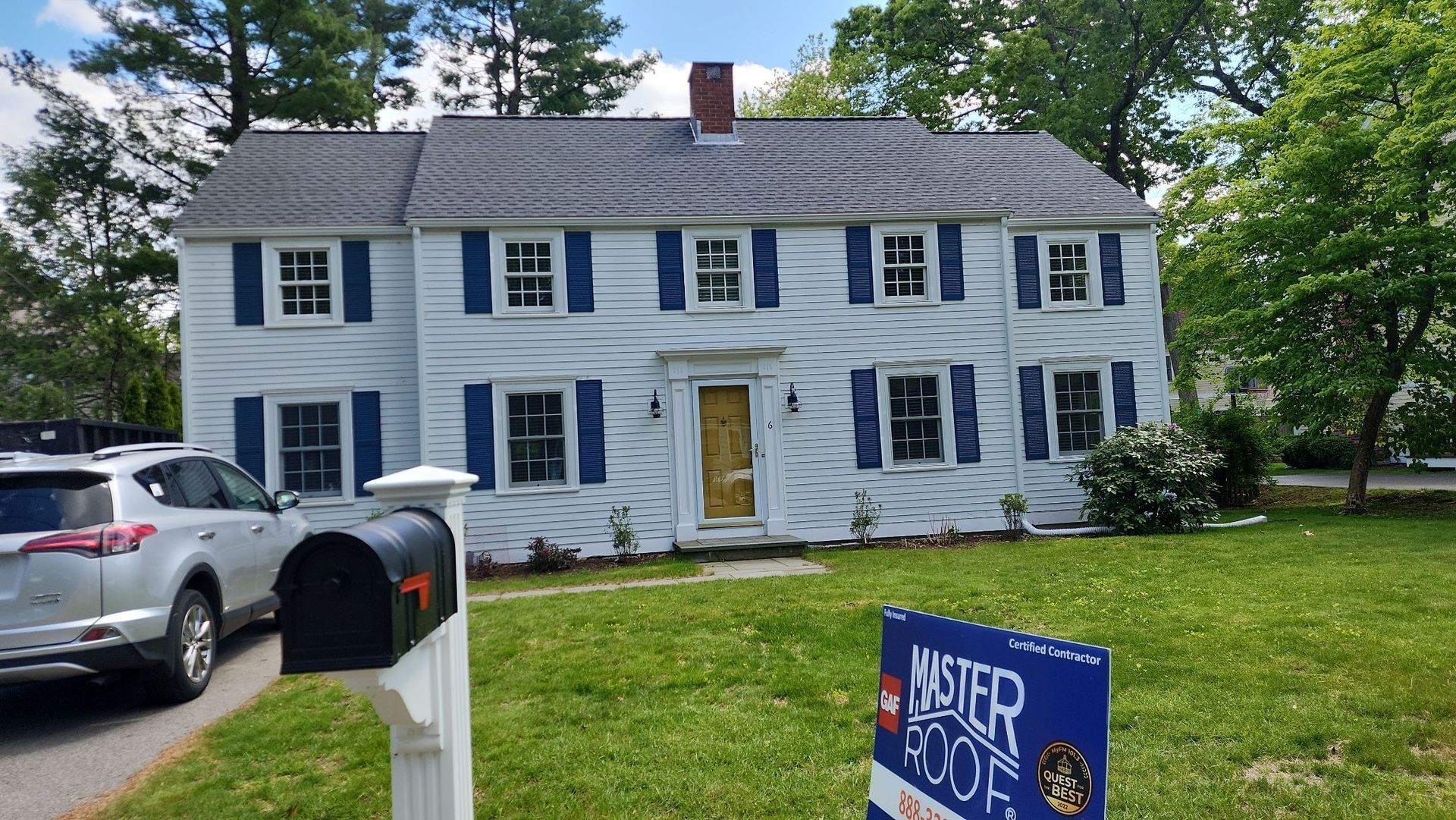 Replaced roof in front  of a MA house