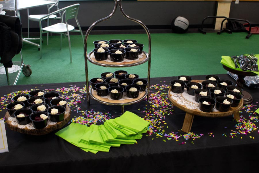 A table with a variety of desserts and napkins on it