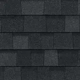 A close up of a row of black shingles on a roof.