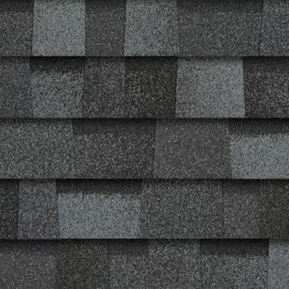 A close up of a row of gray shingles on a roof.
