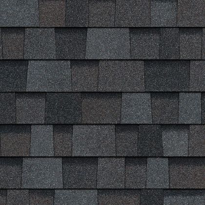 A close up of a roof with a lot of shingles on it.