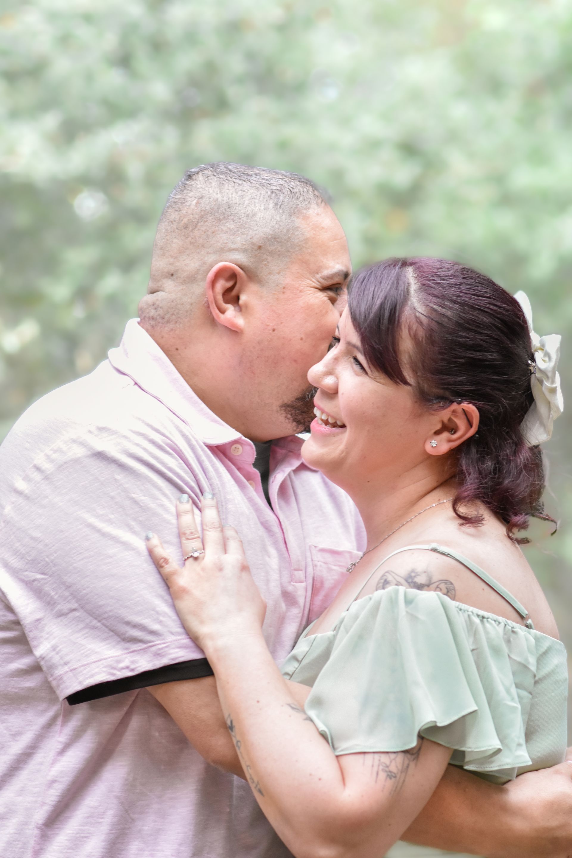 A man and a woman are looking into each other 's eyes.