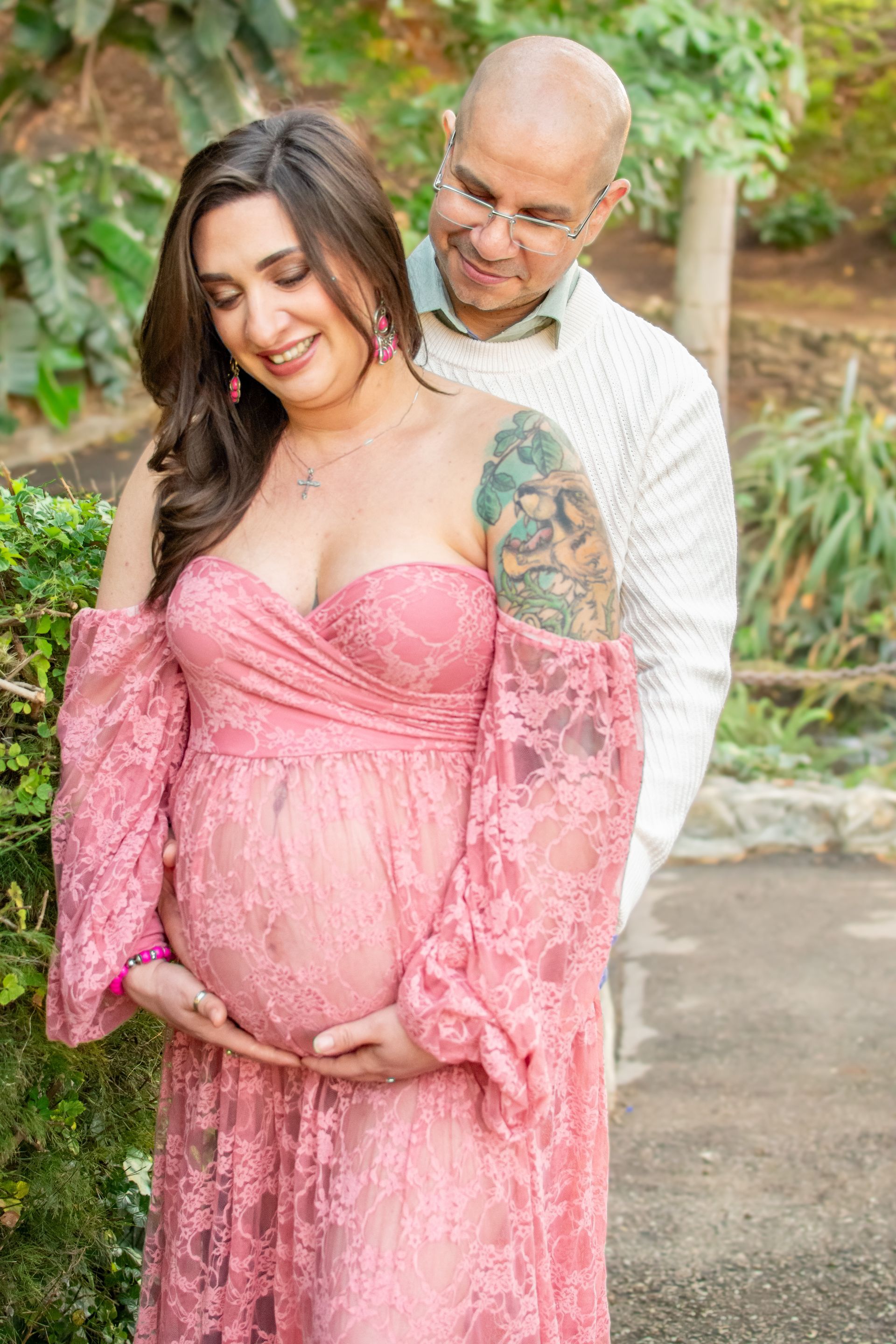 Expecting parents hugging in Averill Park