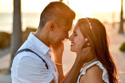 A man and a woman are looking into each other 's eyes.