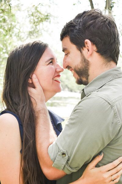 A man and a woman are looking into each other 's eyes.