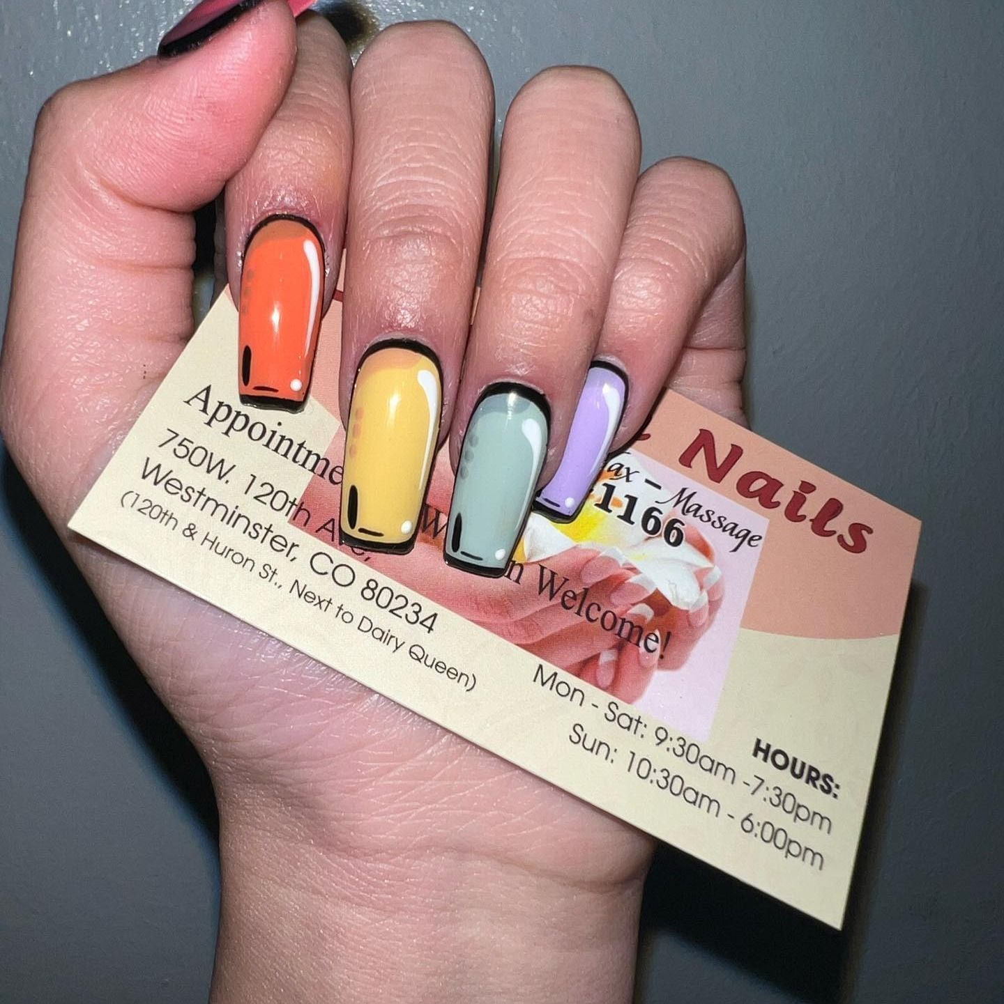 Hand holding a business card for 