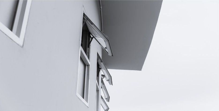 Awning window on a gray building