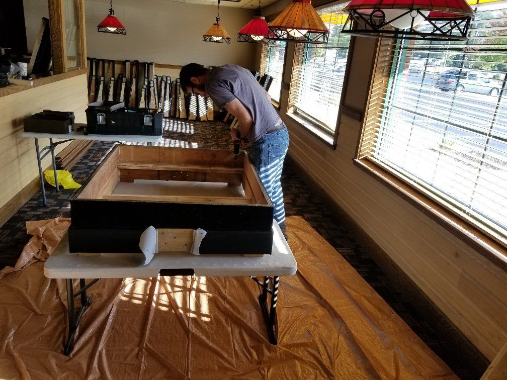 Man Repairing a Chair — Watertown, WI — Recovery Room Commercial Upholstery