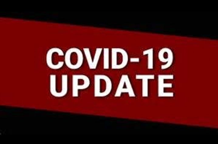 A red and black sign that says `` covid-19 update ''