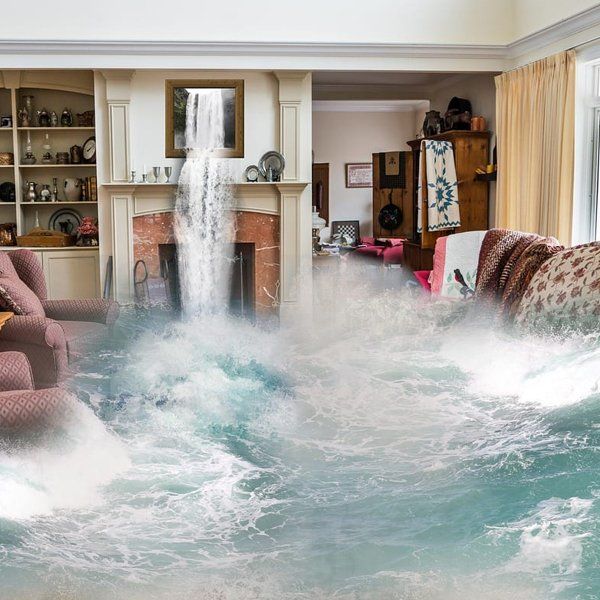 A living room filled with water and a waterfall in the background.
