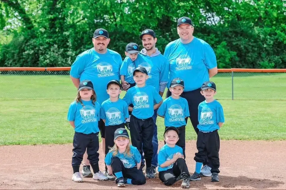 A man and a woman are standing in front of a building.