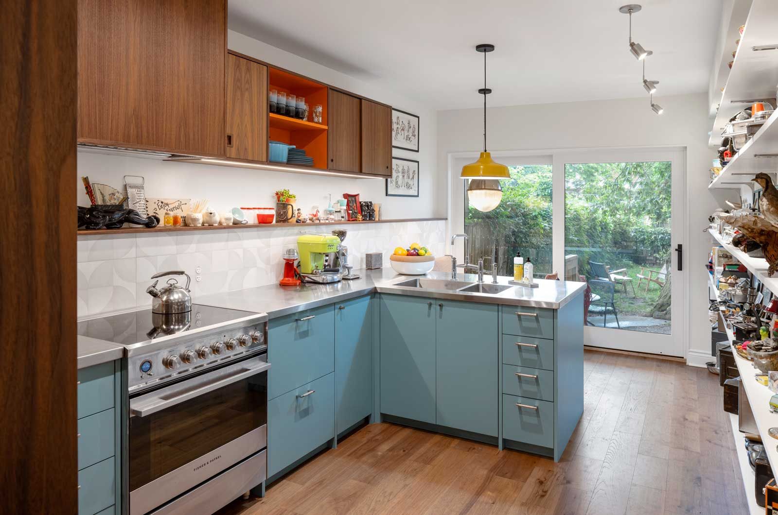 A kitchen with a sink and a lot of windows