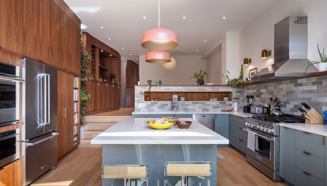 A kitchen addition with stainless steel appliances and a large island.