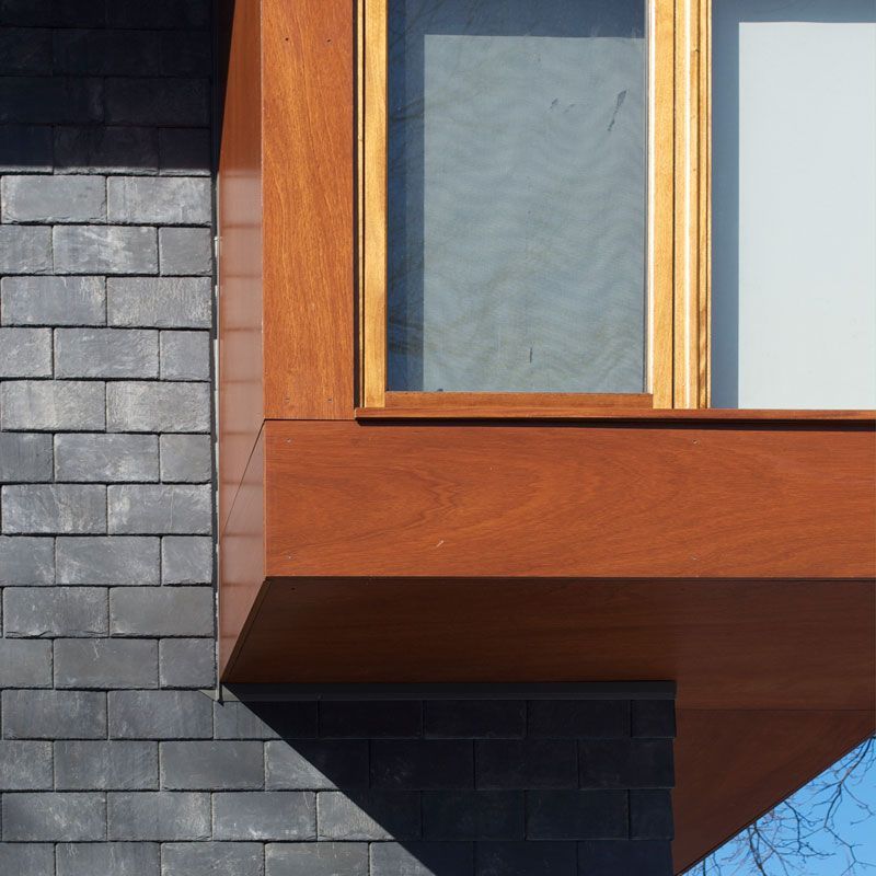 A window on a building with a wooden frame
