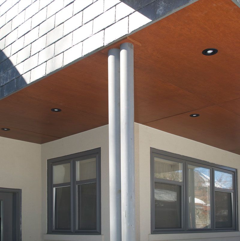 A building with a wooden ceiling and a few windows
