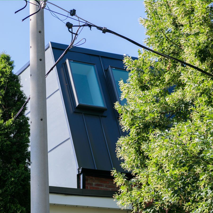 A building with a roof that has a window on it