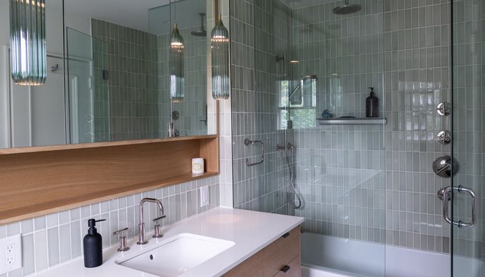 A bathroom with two sinks and two mirrors.