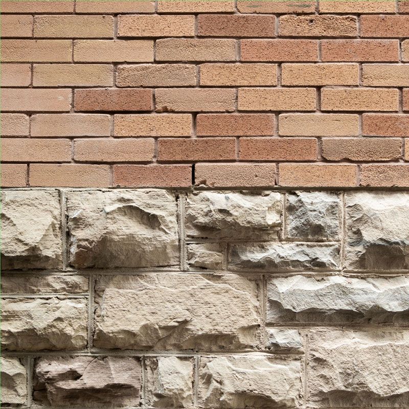 A close up of a brick and stone wall