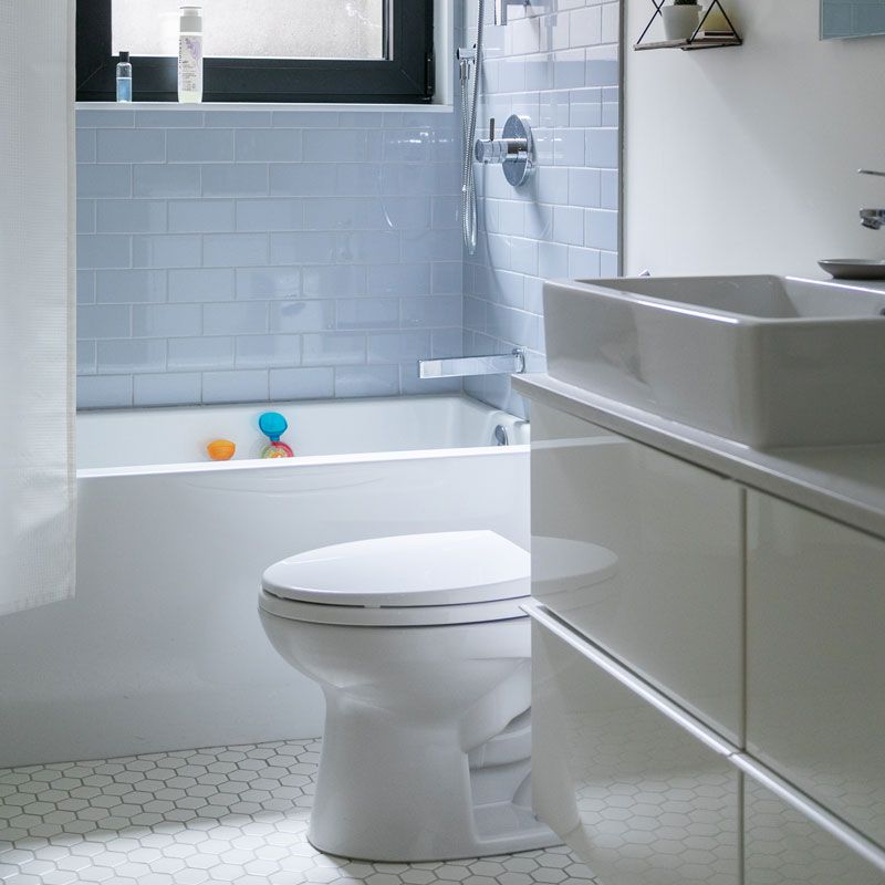 A bathroom with a toilet a sink and a bathtub