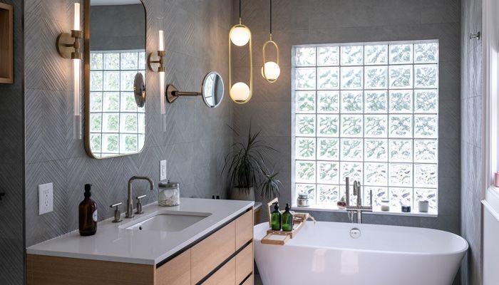 A bathroom with two sinks , a bathtub and a shower.