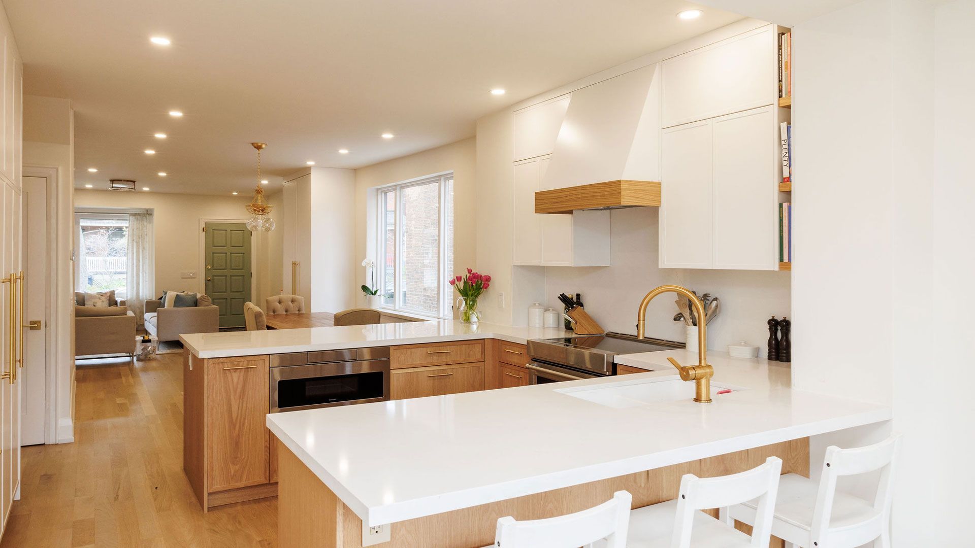 A brick house with a black roof and a chimney