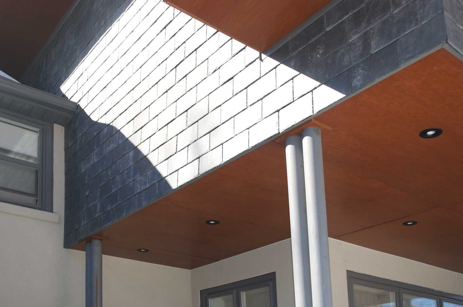 The sun is shining through the roof of a building