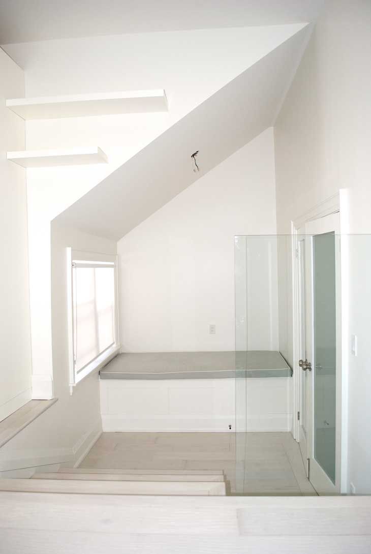 A bathroom with a bathtub and a glass door