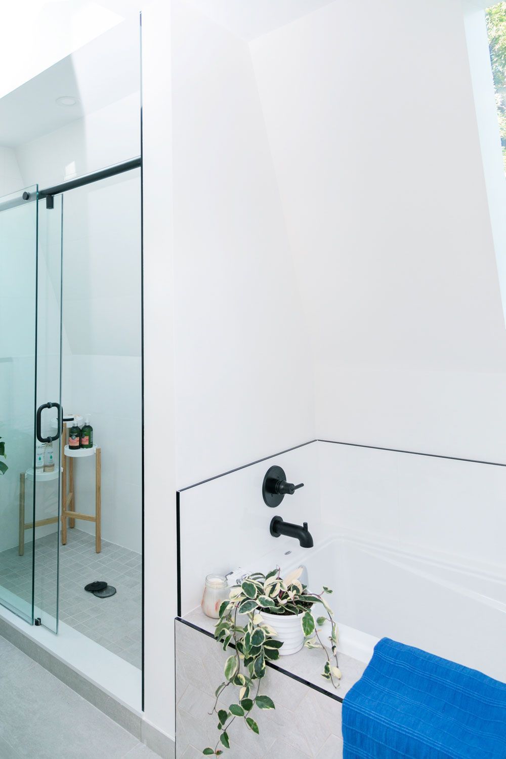 A bathroom remodel with a bathtub and a walk-in shower