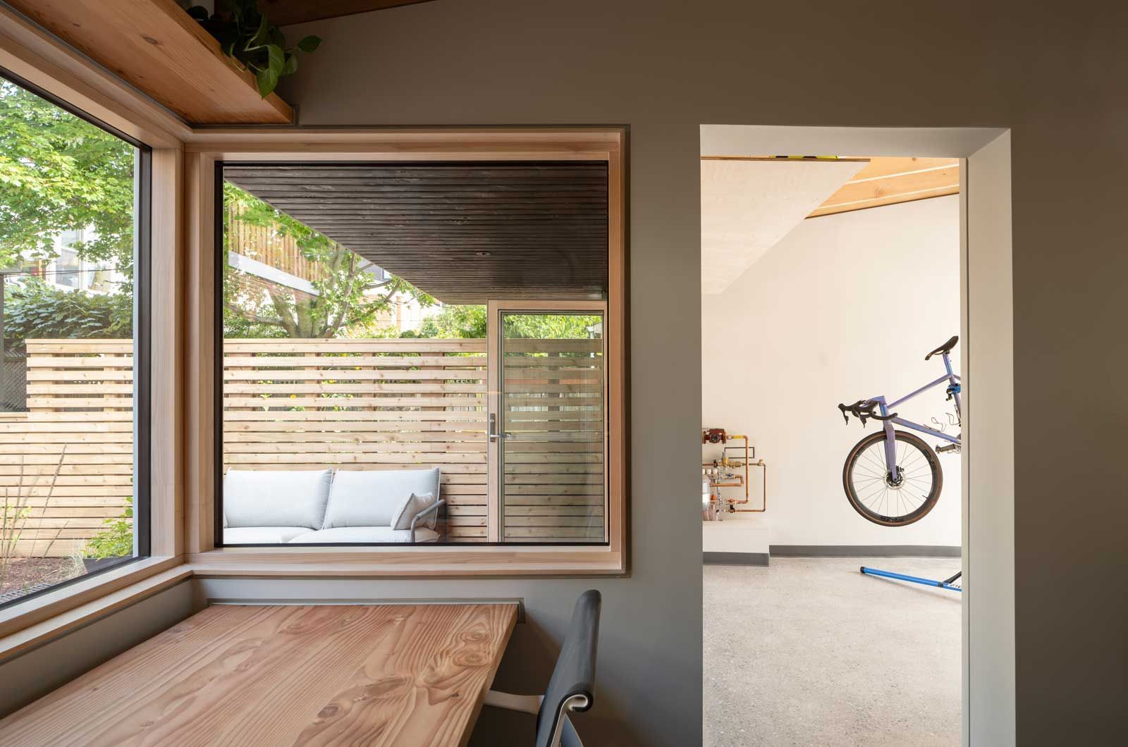 A kitchen with wooden cabinets and a stainless steel dishwasher.