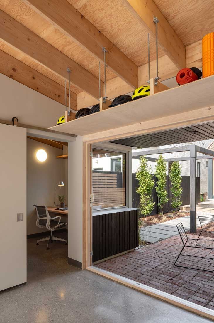 A room with a sliding glass door that leads to a patio.