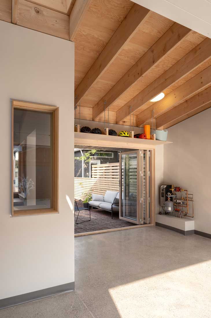 A living room with a sliding glass door leading to a patio.