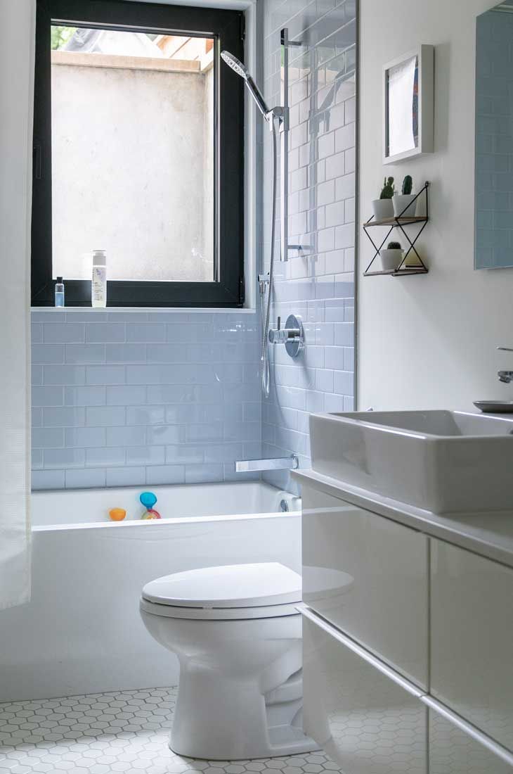 A bathroom with a toilet a sink and a bathtub