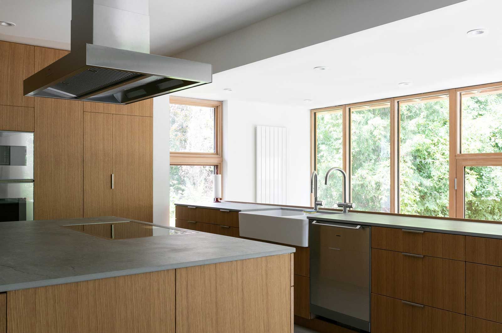 A kitchen with wooden cabinets and stainless steel appliances