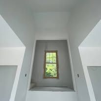 There is a window in the middle of the room.