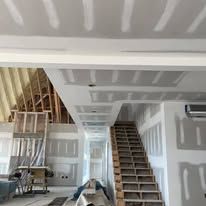 There is a staircase in the middle of the room.