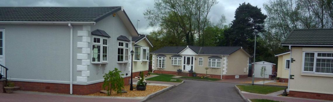 A row of houses are lined up next to each other in a residential area.