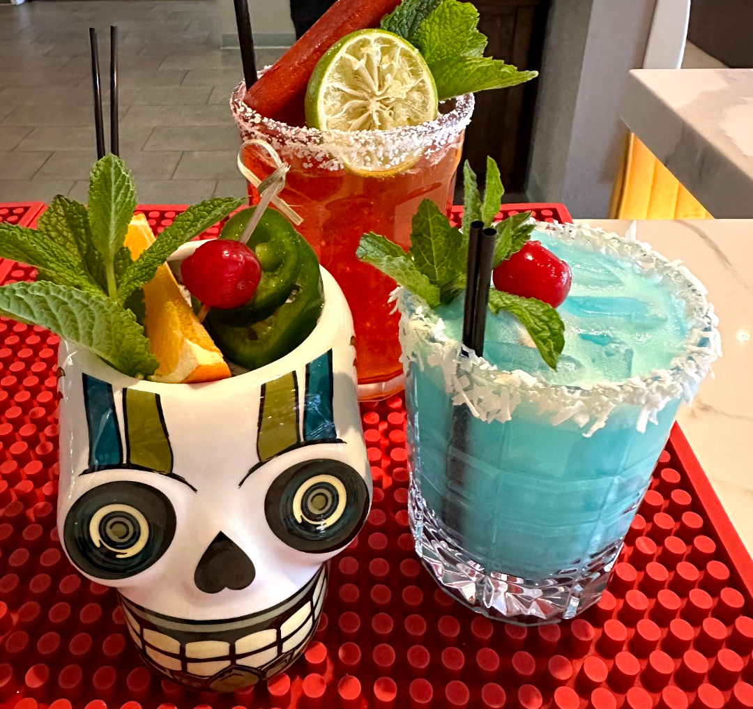 A skull shaped cup with a drink in it