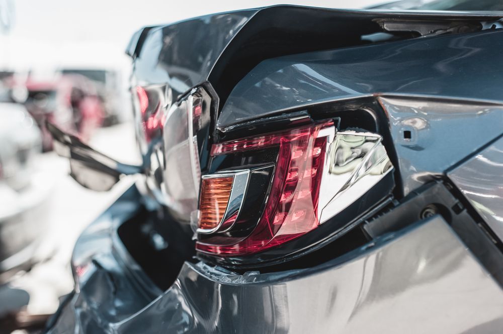 A Close Up Of A Damaged Car With A Broken Tail Light — Fulgi’s South Coast Automotive and Dismantling in Nowra, NSW