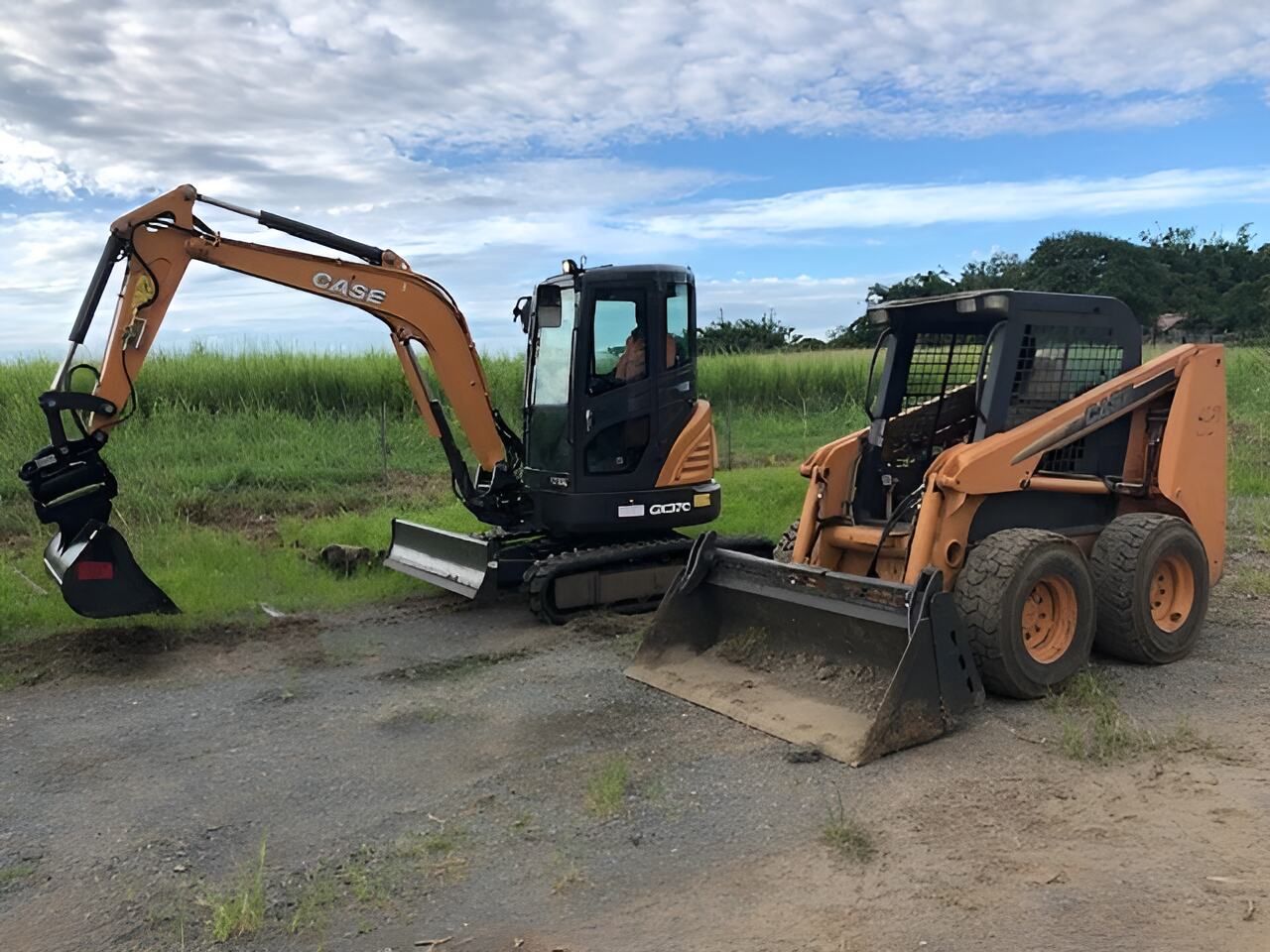 A Small Excavator And A Small Skid Steer Are Parked — Flash Concreting Pty Ltd In Nindaroo, QLD