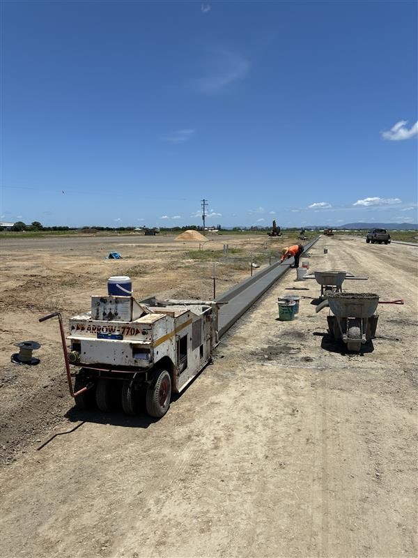 A Row Of Concrete Pipes Draining Water Into A River  — Flash Concreting Pty Ltd In Nindaroo, QLD