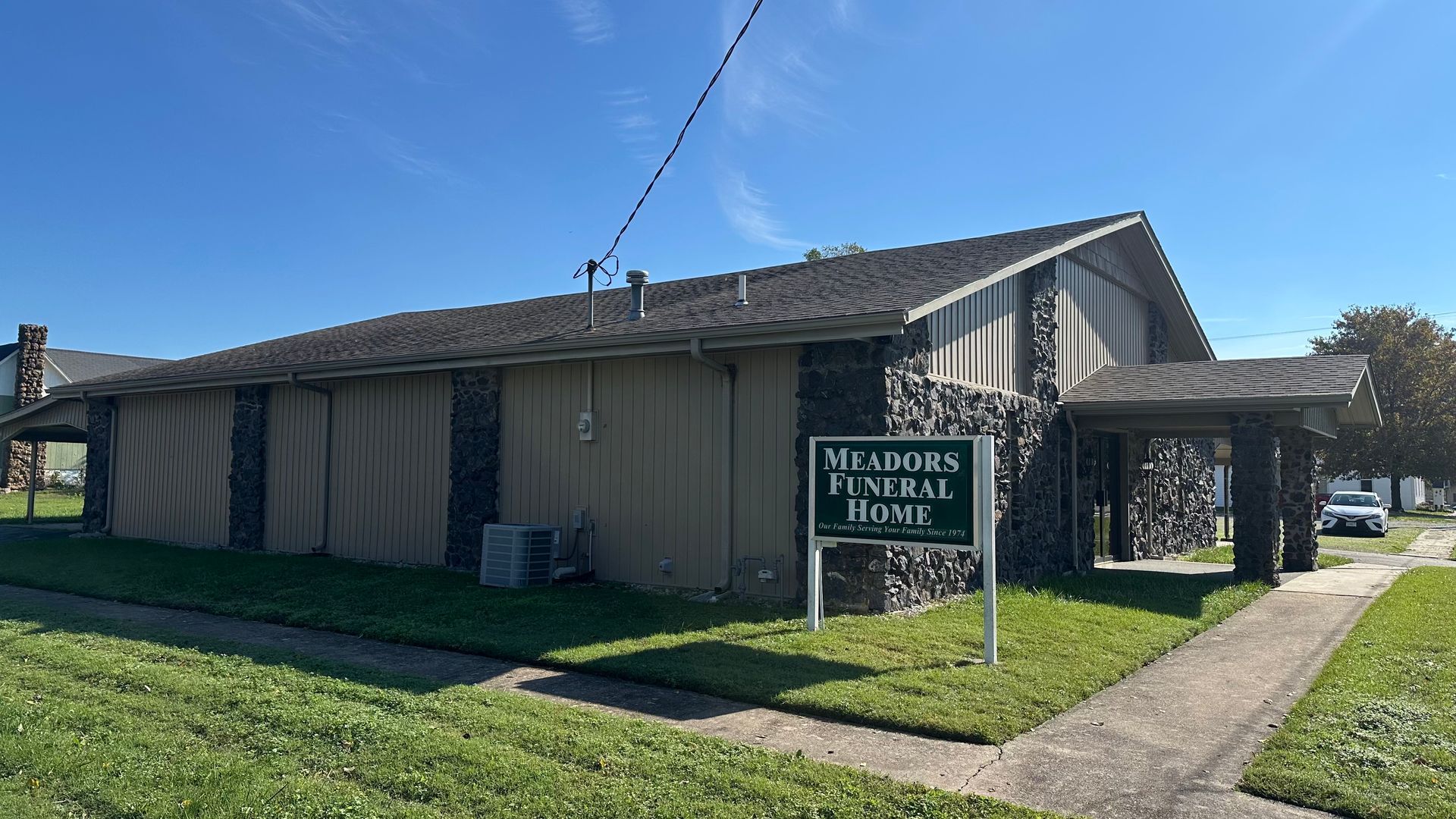 Rolling green hills and a blue sky.
