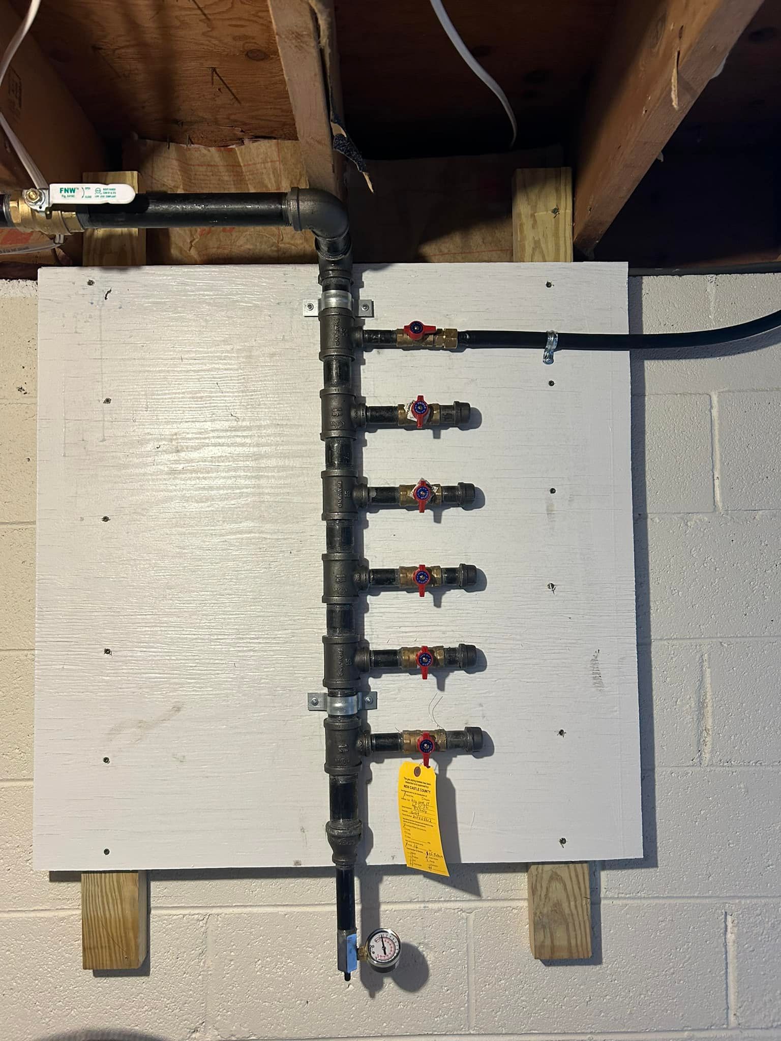 Aqua Plumbing Pros | A bunch of pipes are connected to a wall.