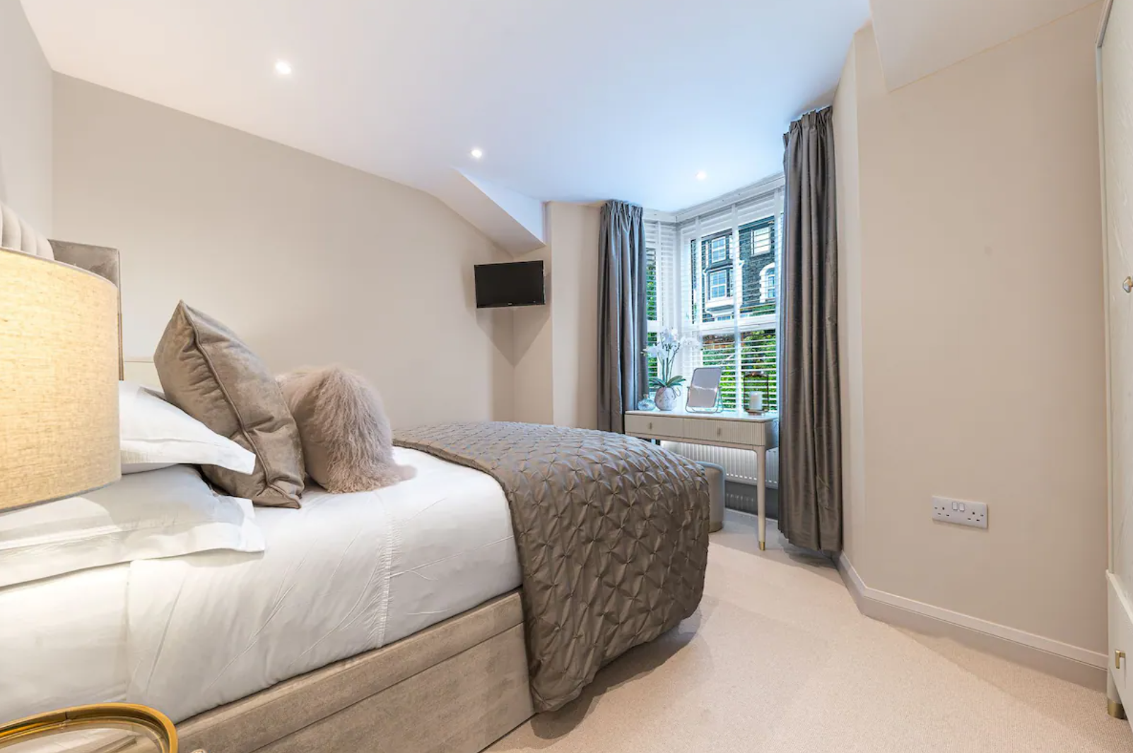 Windermere holiday let - Master bedroom with dressed bed
