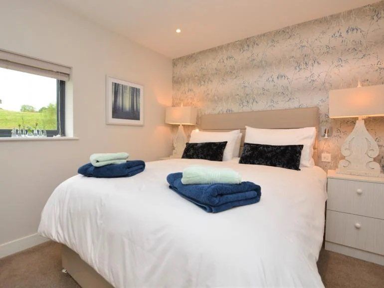 Lovely double bedroom and feature wallpaper