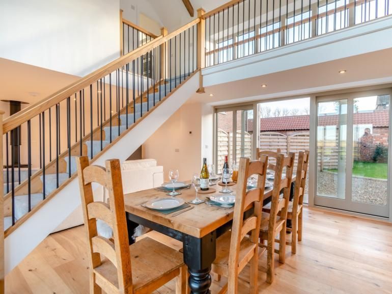 The Threshing Barn -Dining table and stunning staircase