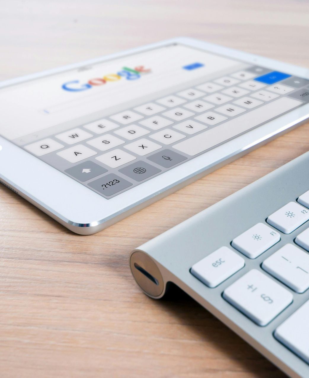 Tandem Growth.  A tablet is open to a google search page next to a keyboard