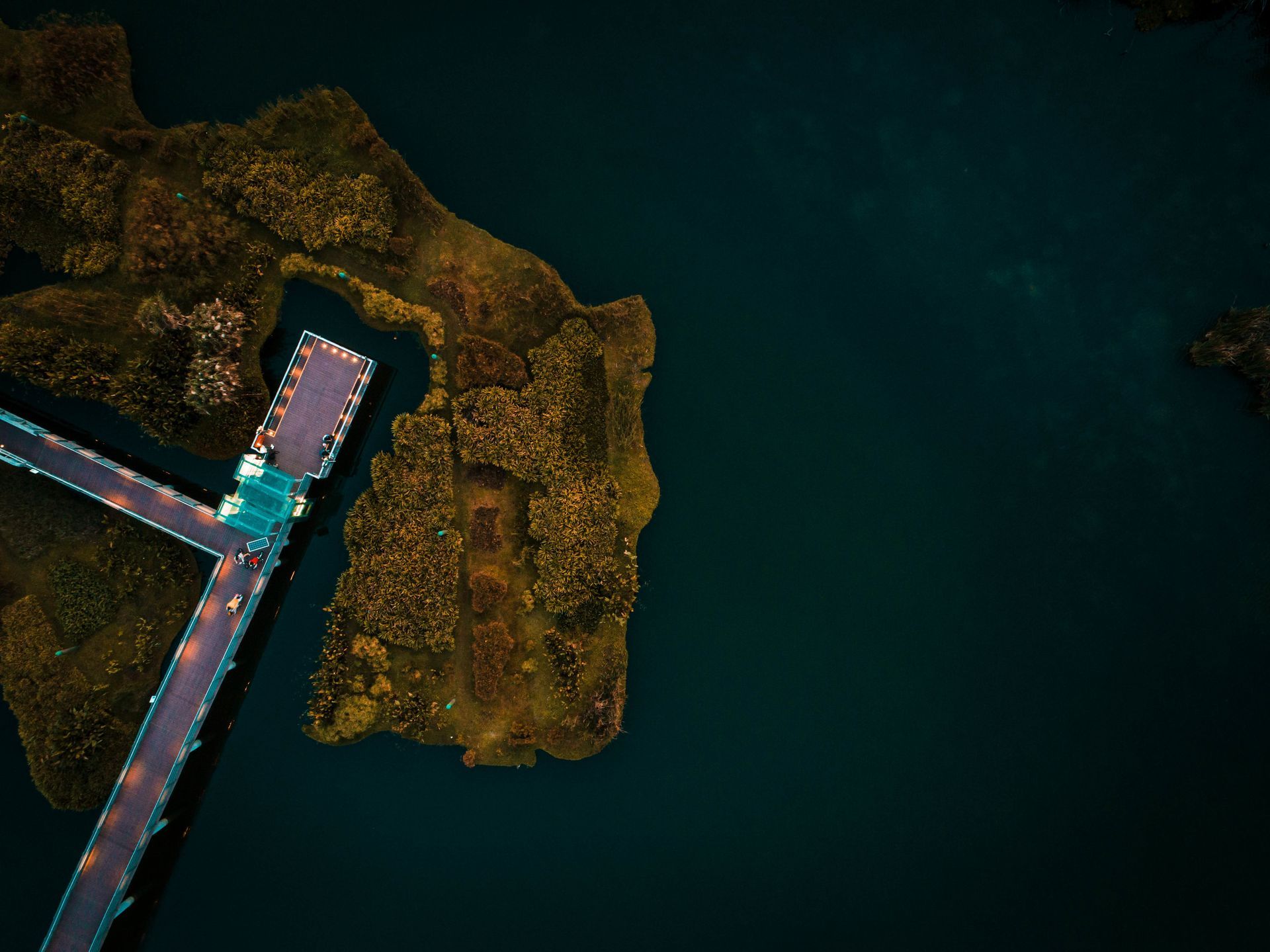 An aerial view of a bridge over a body of water.