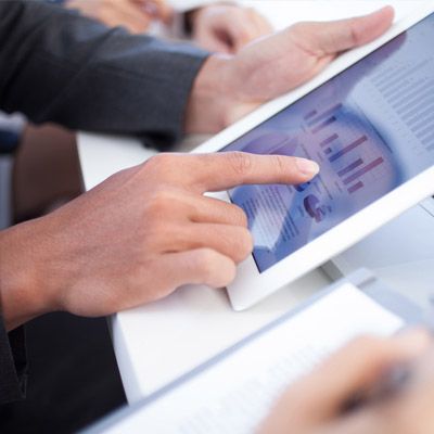 Man reviewing a business model on his tablet