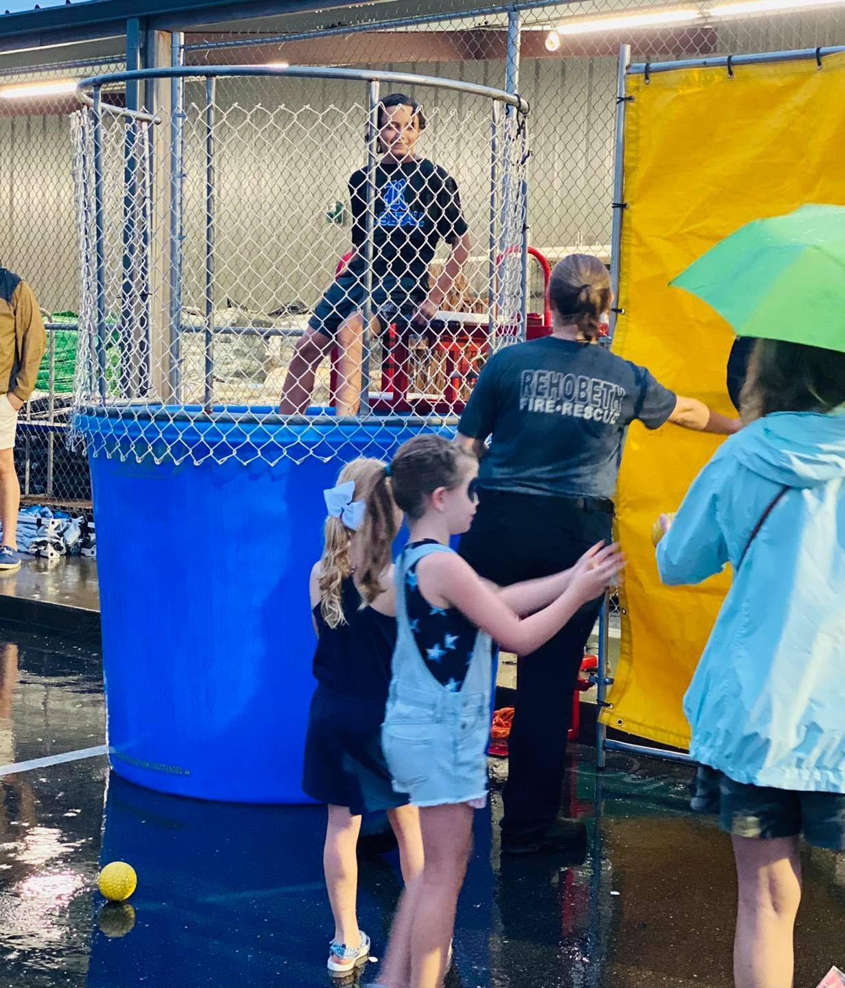 A woman wearing a shirt that says ' converse ' on it