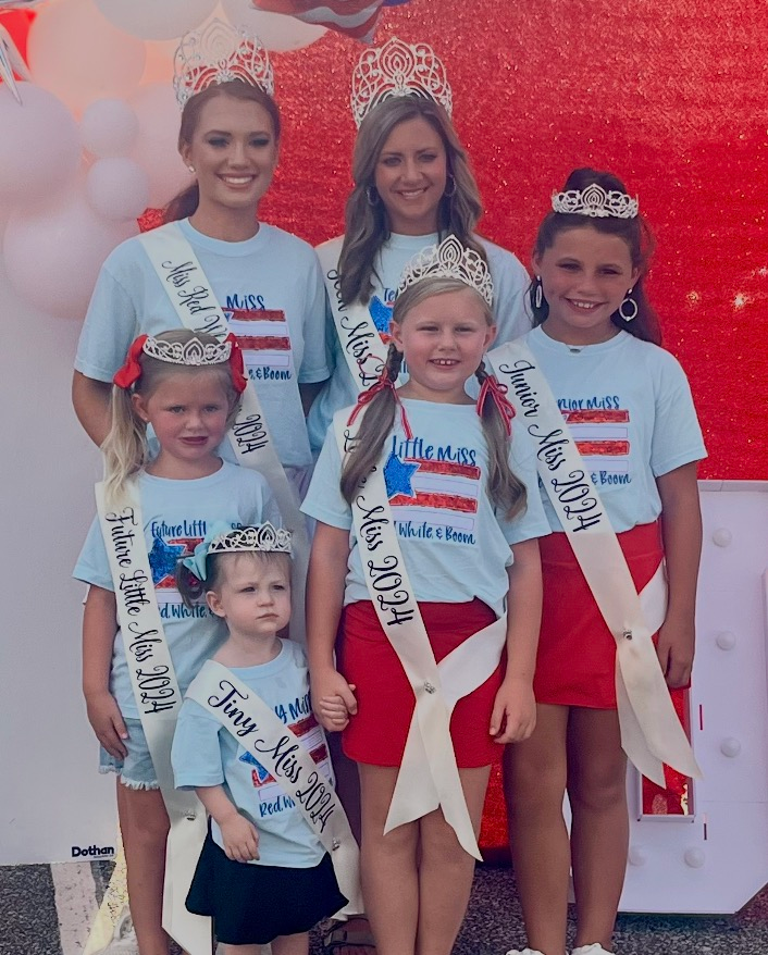 A group of little miss contestants are posing for a picture.